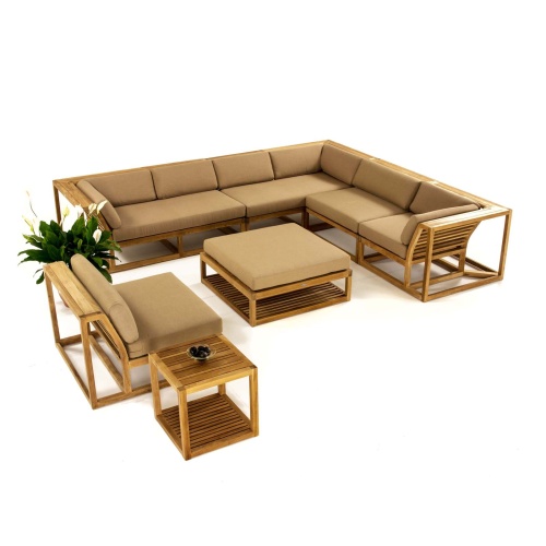 70273 maya deep seating ten piece teak modular conversation set aerial view with cushions blooming plant and bowl of stones on side table on white background