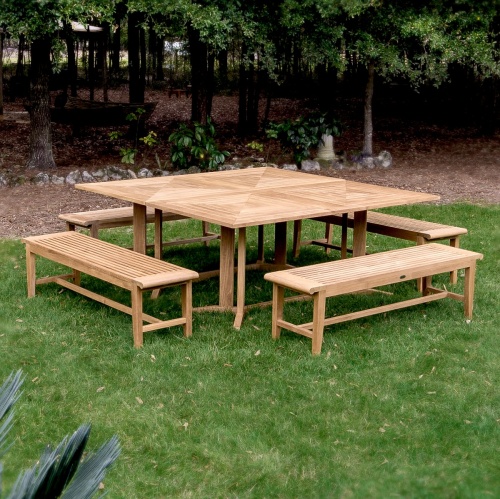 70467 Pyramid Picnic Bench Teak DIning Set on grass lawn with mulched area with trees and landscaped plants in background