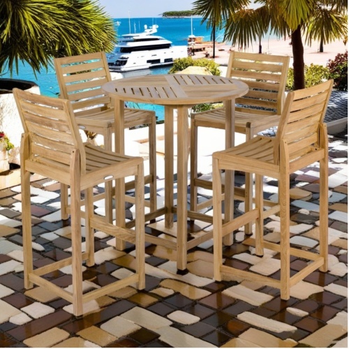 70514 Somerset 5 piece Bar Set 36 inch round teak bar table angled on patio surrounded by palm trees and plants overlooking ocean and yachts in background 