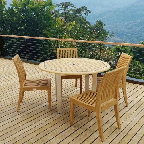 70739  Vogue Laguna 4 foot Round Dining Set in angled side view on wood deck with mountain views in background