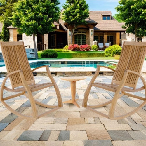70776 aria rockers and table Chat Set  of 2 Aria Teak Rockers and Saloma Teak Side Table on paver patio with pool and house with landscaping and green grass in background 