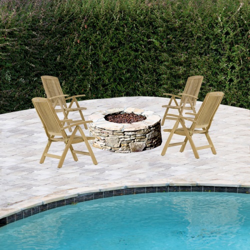 70785 Barbuda 4 piece Recliner Fire Pit Seating around a stone fire pit with pool in front and a hedge in background
