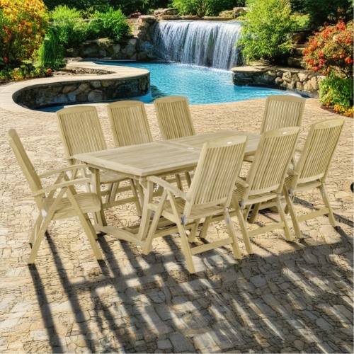 70796 Teak 9 piece Reclining Dining Set of 8 reclining teak dining chairs and teak extendable rectangular dining table angled view on a white background