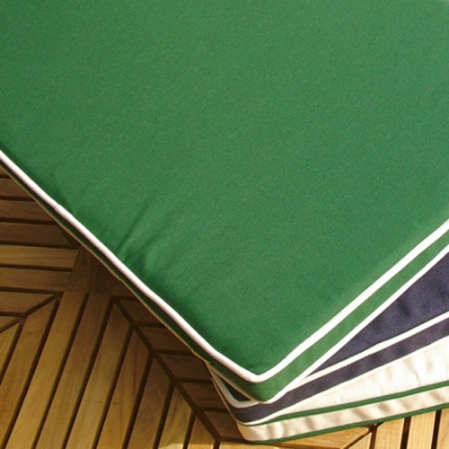 image of 73810MTO Laguna Bench Cushion 4 foot showing 3 cushions in navy blue, forest green, and canvas stacked on top of each other