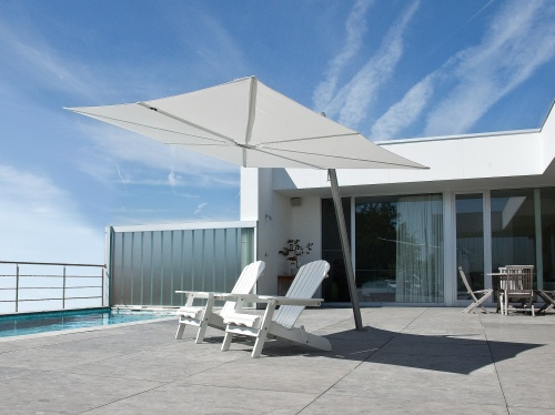  sps25100ffb spectra solo umbrella only with two andirondack chairs on concrete paver deck set pool view blue sky railing fence house and glass door in background 