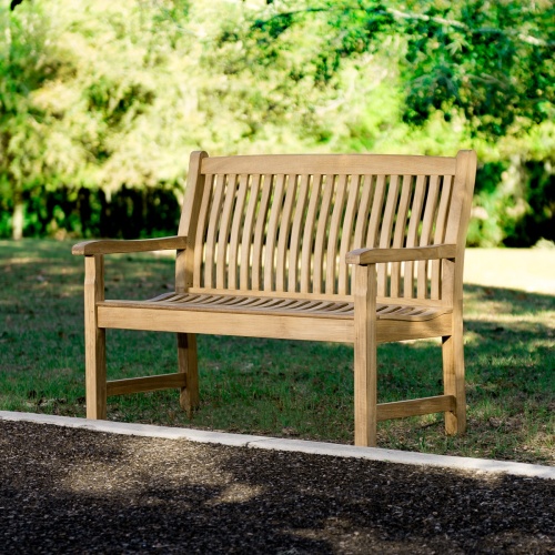13218 4 foot Veranda Teak Bench on grass field with garden in front and trees in background