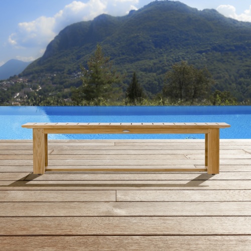 13909 Horizon teak 6 foot long Backless Bench side view on wood dock overlooking blue lake and trees and hills in background