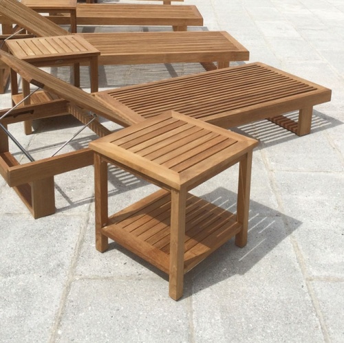 14107 Veranda Teak End Tables with horizon loungers on concrete patio