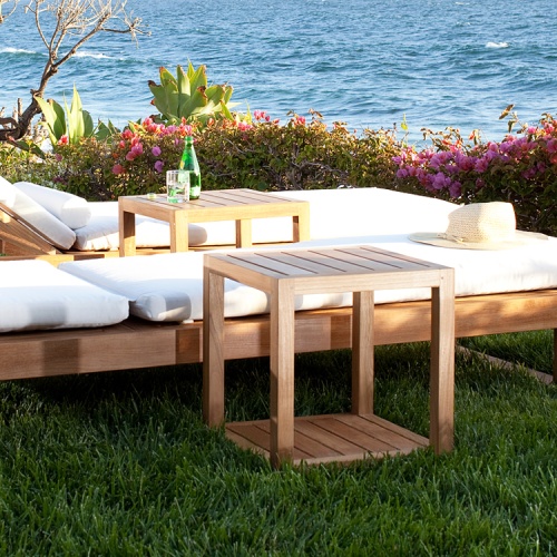 14810 Horizon Teak Side Table on grass with Horizon loungers and ocean in background