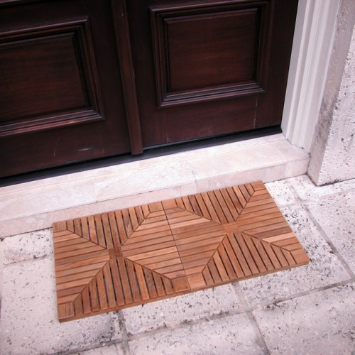 18408DM Teak Diamond Door Mats showing 2 in front of entry door on brick step outside with house in background
