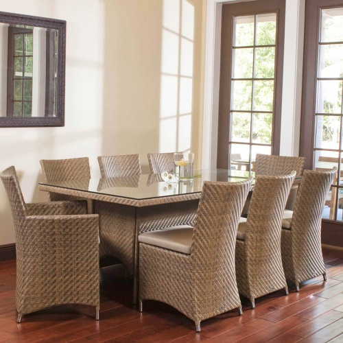 Valencia Rectangular Wicker Seagrass Table with six side chairs and 2 dining chairs in livingroom  by patio doors