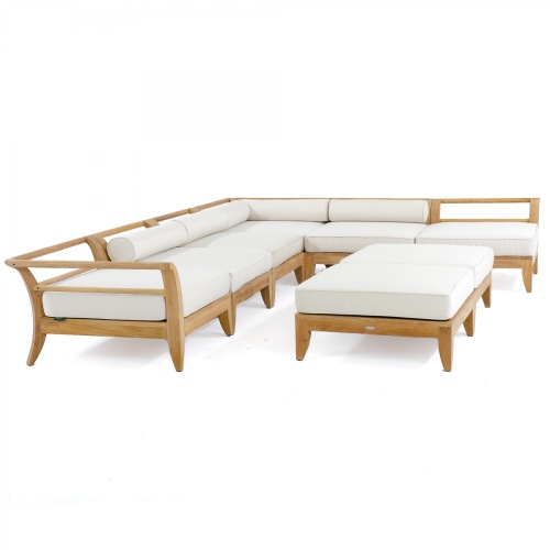 70101 aman dais eight piece teak daybed set showing two corner four end two ottomans with cushions front angled on white background