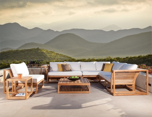 70230 Maya collection with canvas cushions four throw pillows bowl of green apples a potted succulent magazine on tables on a concrete patio with mountain views in background