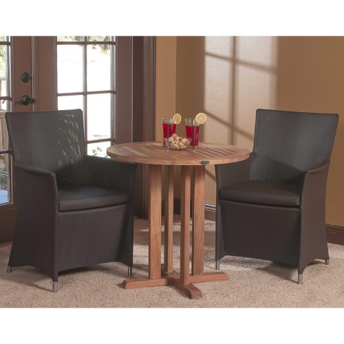 70272 Apollo 3 piece Bistro Set of 2 Tobacco Apollo Chairs and Teak 30 inch Round Table with 2 glasses set on rug indoors with windows in back 