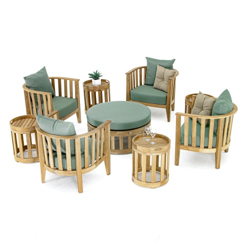 70437 Kafelonia nine piece teak deep seating chat set with potted plant and two wine glasses on side tables and two throw pillows on two chairs on white background