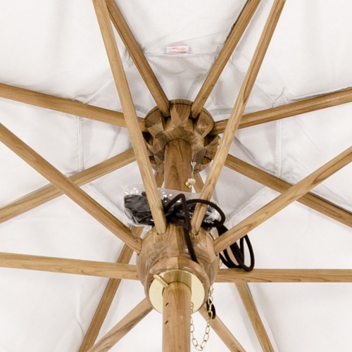 17540F Somerset 8 foot Round teak Umbrella inside construction showing the umbrella arms supporting a white fabric and black rope atop the hub