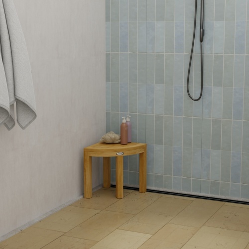 18818 Pacifica Corner Spa Stool in shower showing a loofah and 2 bottles of shampoo on top in a front aerial view