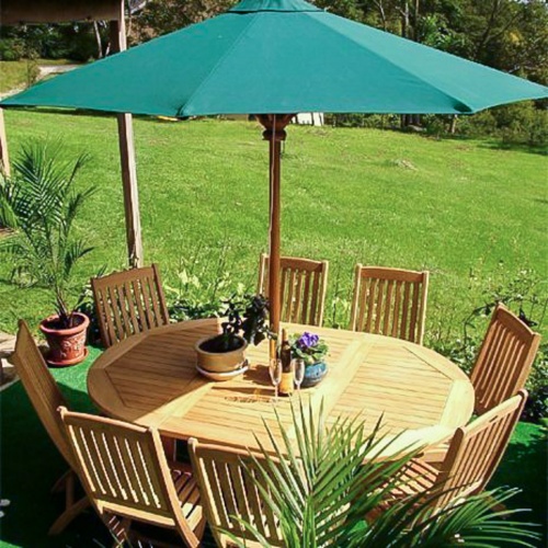 70060 Barbuda Martinique 9 piece oval Dining Set with optional open market umbrella 2 potted plants bottle of wine and two glasses aerial view potted palms plants and grass background