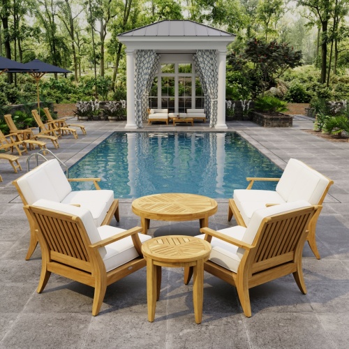 70347 Laguna 6 pc Sofa Set on paver patio facing a pool pavilion with landscaping plants and woods and trail in background