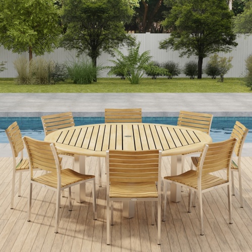 70444 Vogue Teak Dining Set for 8 in angled side view on outdoor deck in front of a pool with a fence and plants and trees in background 