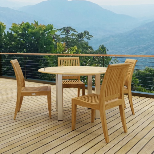70739  Vogue Laguna 4 foot Round Dining Set in angled side view on wood deck with mountain views in background