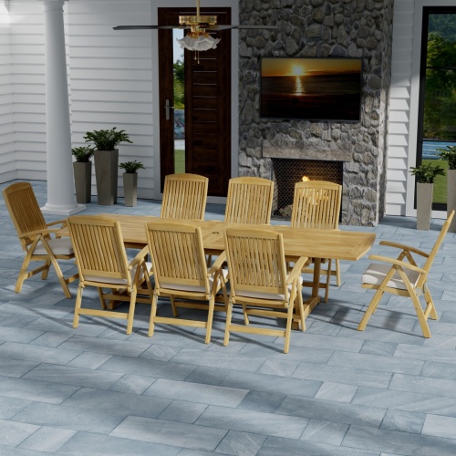 70796 Teak 9 piece Reclining Dining Set in angled side view on slate tiled patio in front of a fireplace with a door and window of house in background