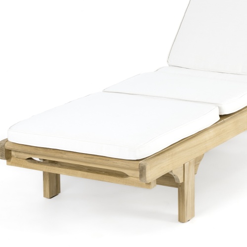 71101NWH Chaise Lounger Cushion in Natte White on teak chaise lounger front angled closeup view of footrest on white background