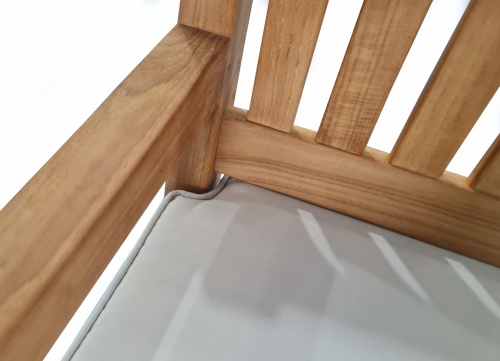 73955CV4 Swinging Bench Cushion with 4 corner cut out on the teak swinging bench closeup view of rear corner on a white background 