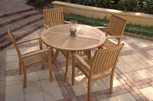 12196ST Sussex Dining Chair showing with 5 piece Grand Hyatt Teak Dining Set on colored stone patio