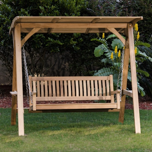 13955bo veranda swinging porch bench with canopy on grass field with trees in background
