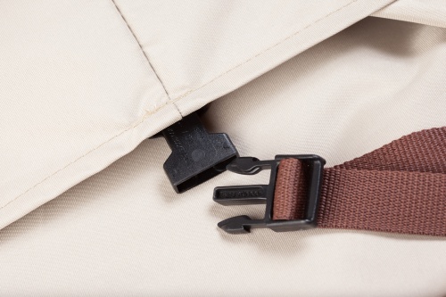 60818 Maya 3 piece Sofa Cover showing closeup view of securing strap clasp buckle on cover