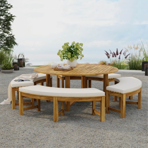 70090 Buckingham Picnic Dining Set with optional seat cushions on outdoor patio with flower vase and tray of coffee and cups with ocean views and plants and trees in background