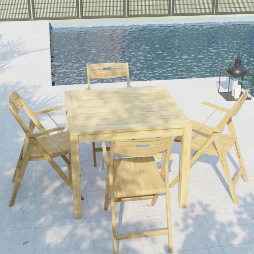 70147 Surf teak 36 inch square 5 pc Dining Set of 4 teak folding Dining Chairs and a teak 36 inch square dining table in angled aerial view on patio with pool and fence in background