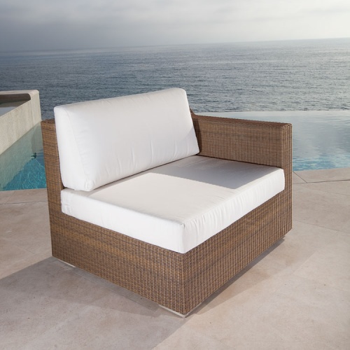  70241 malaga woven wicker left side sectional with cushions front angle view on pool deck with infinity pool and ocean background