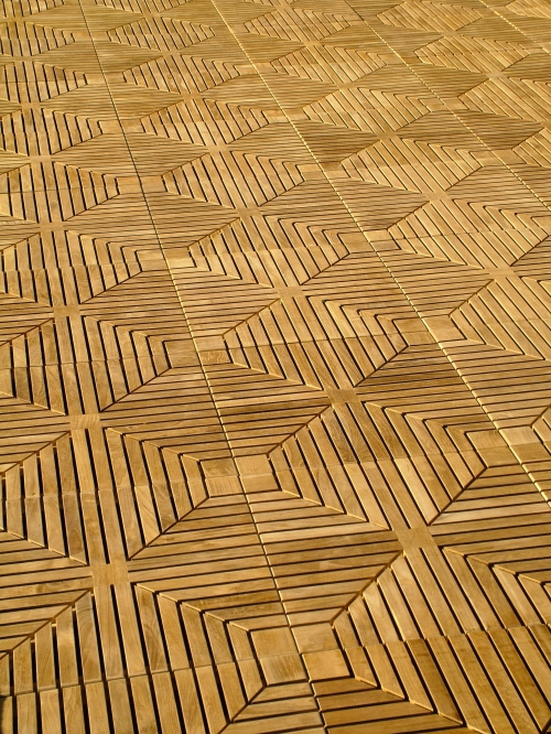 70411 Diamond Teak Tiles showing ten cartons covering one hundred square feet on floor