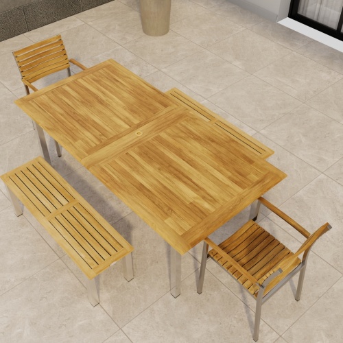70445 Vogue Bench Dining Set of a Vogue stainless steel and teak Extension Table and 2 Dining Chairs and two 4 ft  Backless Benches in angled aerial view of table top on tiled patio