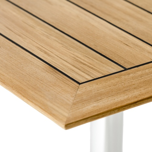 70590 Vogue Sussex 36 inch square teak and stainless steel dining table showing closeup of table top and corner edge coated with sikaflex marine sealant  on a white background