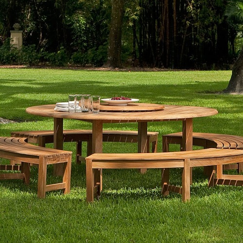 13937 Buckingham Picnic Dining Set with white bowl of grapes 4 white plates stacked and 4 glasses on table top side view on grass field with trees in background