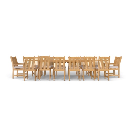 70361 Laguna Veranda 15 piece teak Dining Set of 2 Veranda dining armchairs and 10 side chairs with optional cushions around a teak rectangular extendable dining table in side profile view on white background