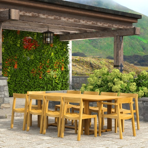 70457 Horizon 11 pc Teak Dining Set in angled side view on covered patio with vines and landscape plants with hillside in background