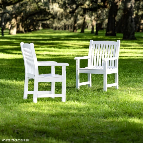 English Style Teak Dining Chairs with Poly Finish on Green Grass with Trees in the background by Meadow