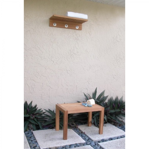 18730 Pacifica Towel Shelf hanging on outside concrete wall with stool underneath