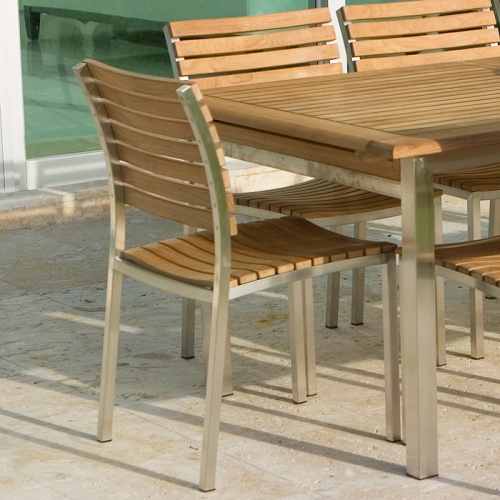 21007 Vogue Side Chair on concrete patio at end of Vogue Extension table
