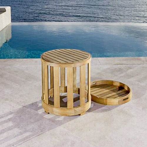 70437 Kafelonia round teak side table with teak tray on pool deck next to table with pool ocean and blue sky in background