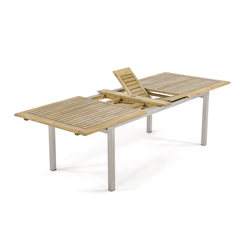 70756 Vogue teak and stainless steel extension dining table side angled view showing extended position with butterfly leaves open on white background