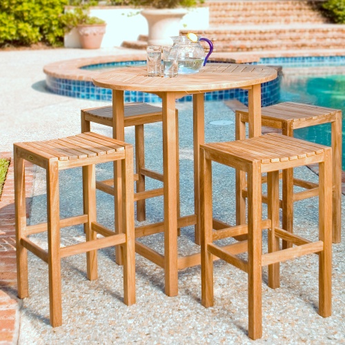 70899 Somerset Backless Barstool Set of four 12110 Somerset backless barstools around a teak bar table on pool deck with pool and jacuzzi in background 