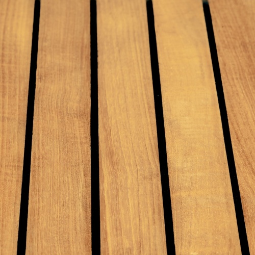 70443 Vogue teak and stainless steel dining table closeup view of table top with sikaflex sealant between the slats
