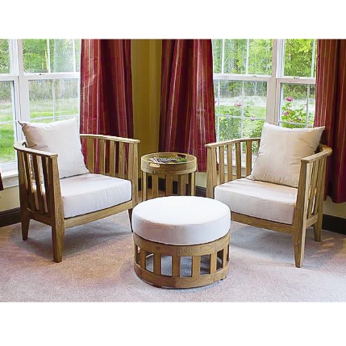 12170dp Kafelonia four piece lounge set front angle view on carpet magazines on side table windows with drapes and landscaped yard in background 