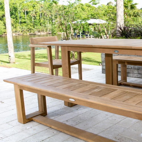 13909 Horizon teak 6 foot long Backless Bench and table set with trees and lake in background