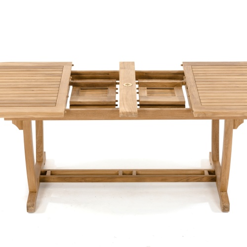 70008 Montserrat Veranda oval teak dining table showing dual butterfly leaf extensions in storage on white background